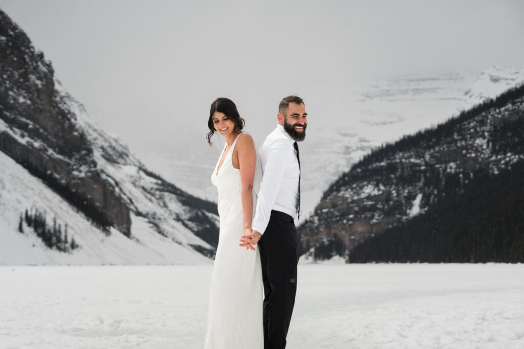 classic Banff mountain elopement on frozen lake louise in winter