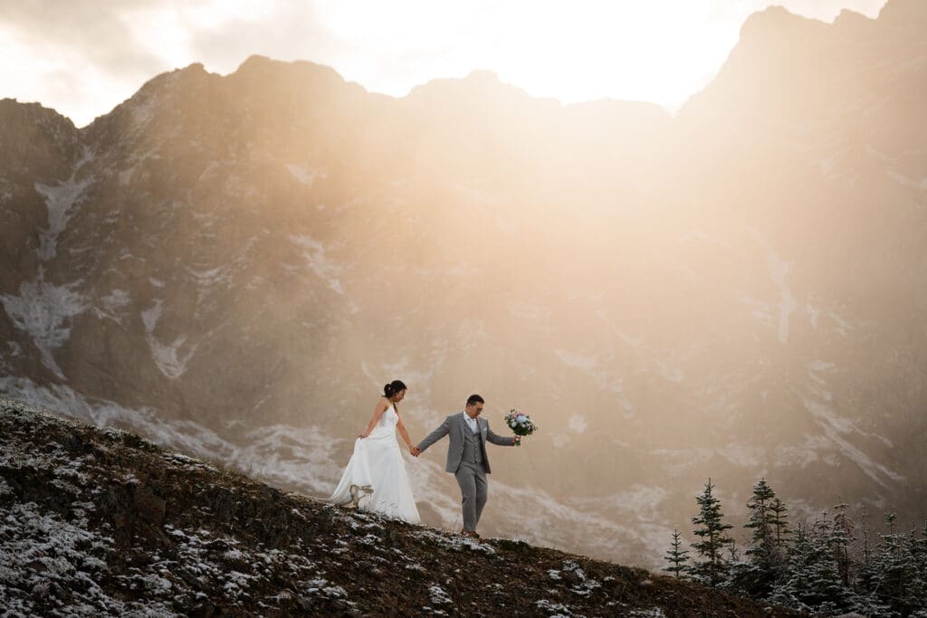 Couple hiking during elopement in Kananaskis, Alberta